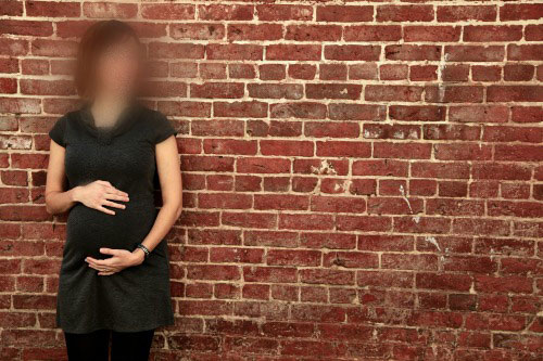 pregnant woman blurred out face